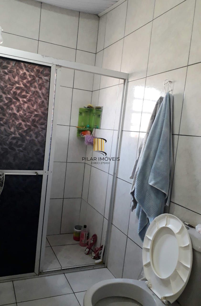 Terreno com 2 casas de Alvenaria