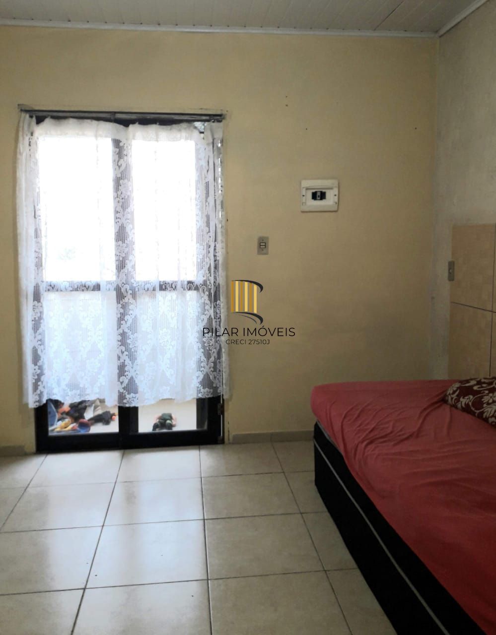 Terreno com 2 casas de Alvenaria