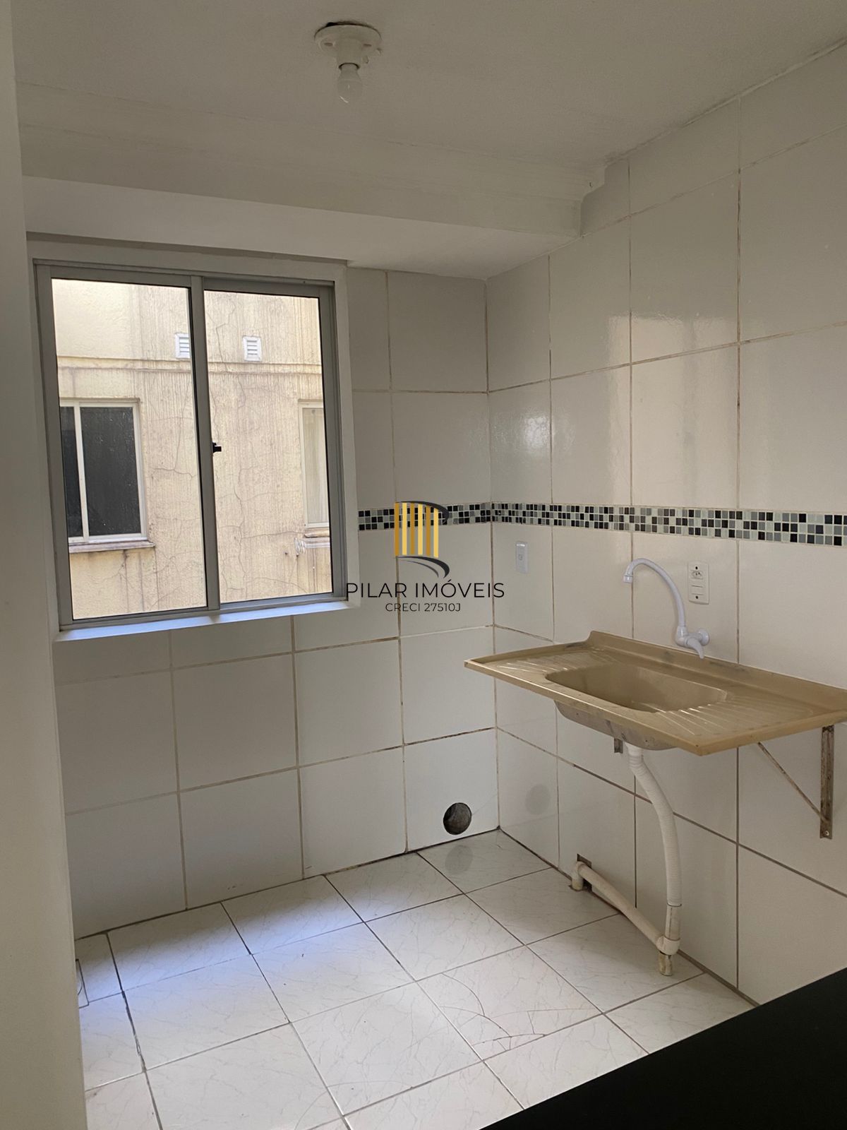 Apartamento de 2 dormitórios e vaga rotativa na Vila Nova - Pilar Imóveis