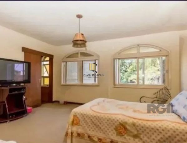 Casa sobrado no bairro Tristeza de 4 dormitórios