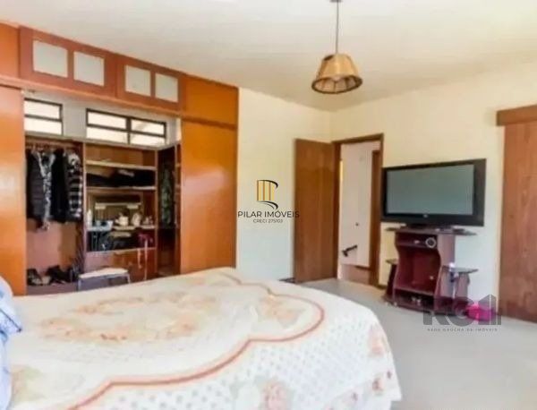 Casa sobrado no bairro Tristeza de 4 dormitórios