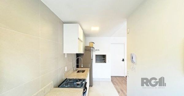 Apartamento no bairro Auxiliadora de 2 dormitórios vaga e infra