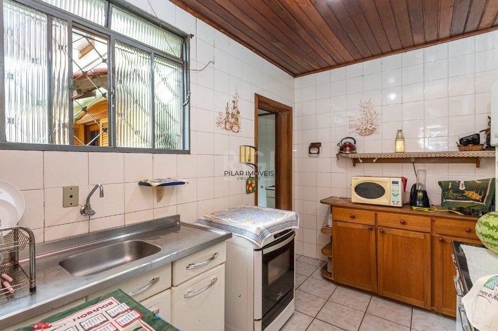 Casa sobrado no Jardim Botânico de 5 dormitórios e 2 vagas