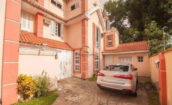 Casa no bairro Camaquã de 4 dormitórios e 2 vagas - Pilar Imóveis