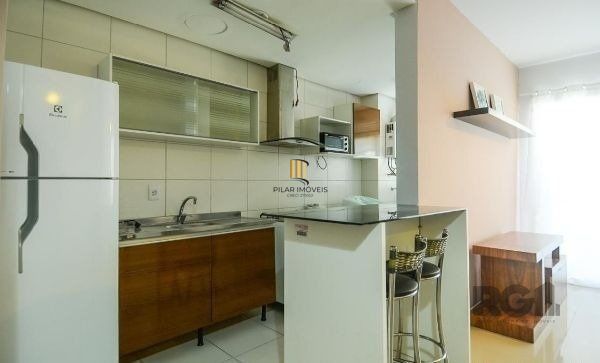 Apartamento no Urbano Menino Deus de 1 dormitório vaga e pátio