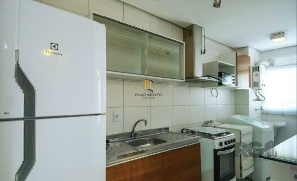 Apartamento no Urbano Menino Deus de 1 dormitório vaga e pátio