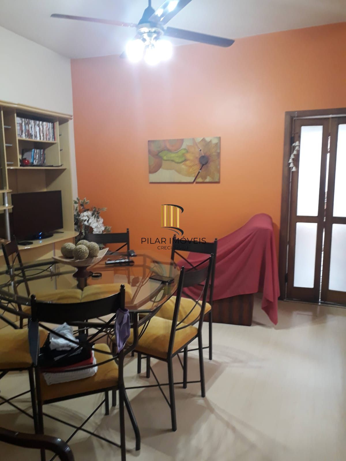 Casa sobrado no bairro Auxiliadora de 3 dormitórios e 3 vagas