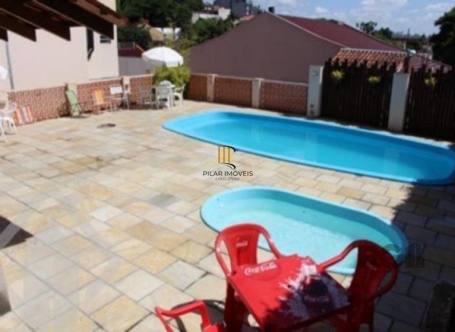 Casa em condomínio no Partenon de 3 dormitórios e vaga