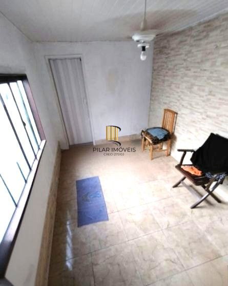 Casa no bairro Partenon de 3 dormitórios e vaga