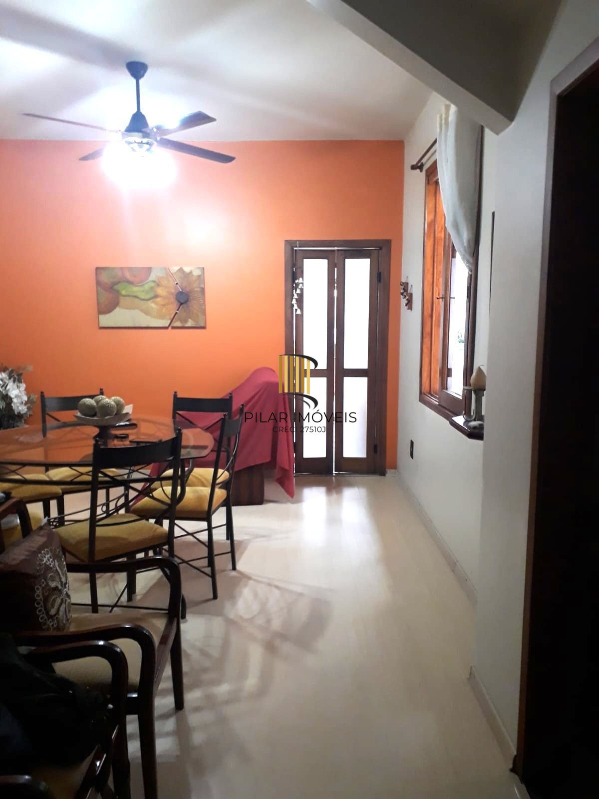 Casa sobrado no bairro Auxiliadora de 3 dormitórios e 3 vagas