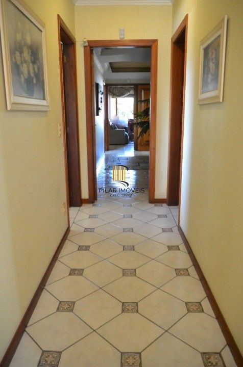Casa Comercial e Residencial com 518m² (4 quartos / 5 banheiros / 3 vagas garagem) no Bairro Partenon localizada à meia quadra da Av. Bento Gonçalves.