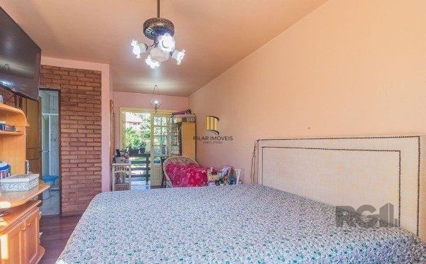 Casa sobrado na Lomba do Pinheiro com 4 dormitórios e 2 vagas