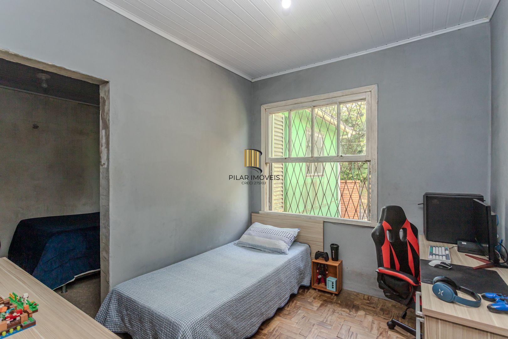 Casa no bairro Jardim Botânico de 3 dormitórios e garagem e terreno com 370m²