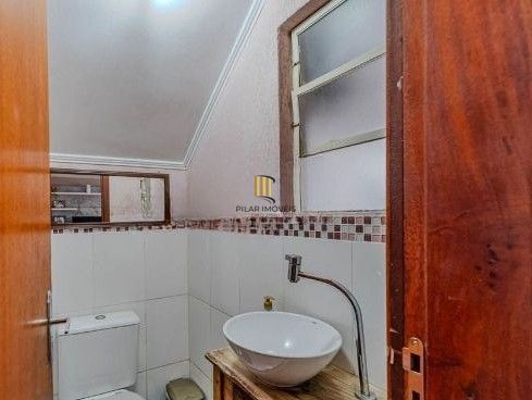 Casa em condomínio no bairro Santo Antômnio de 4 dormitórios e 2 vagas