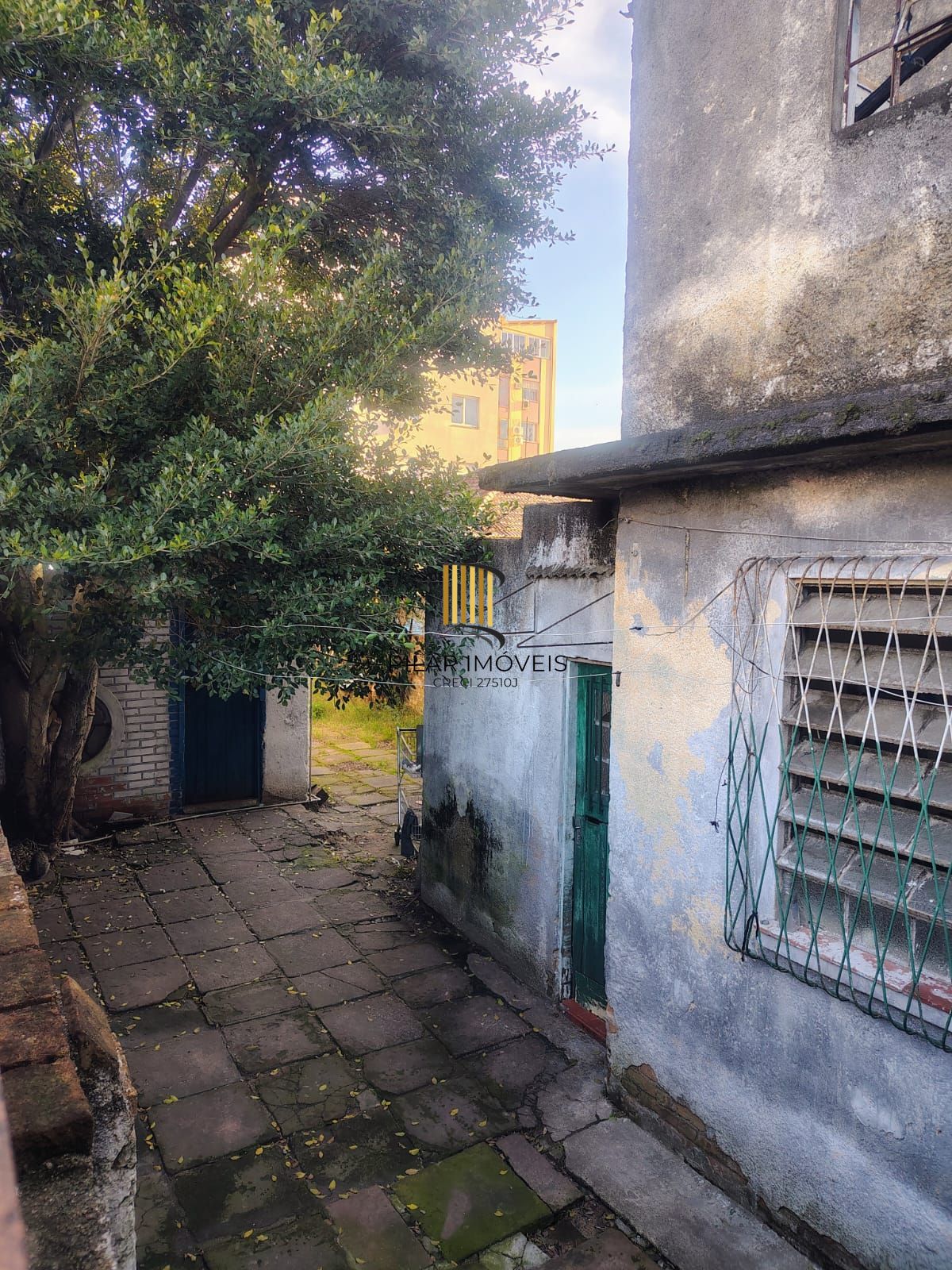 Casa e terreno no Partenon