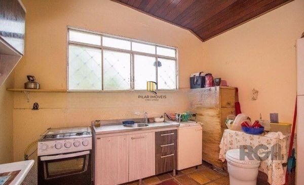 Casa sobrado no bairro Rio Branco de 4 dormitórios e vaga