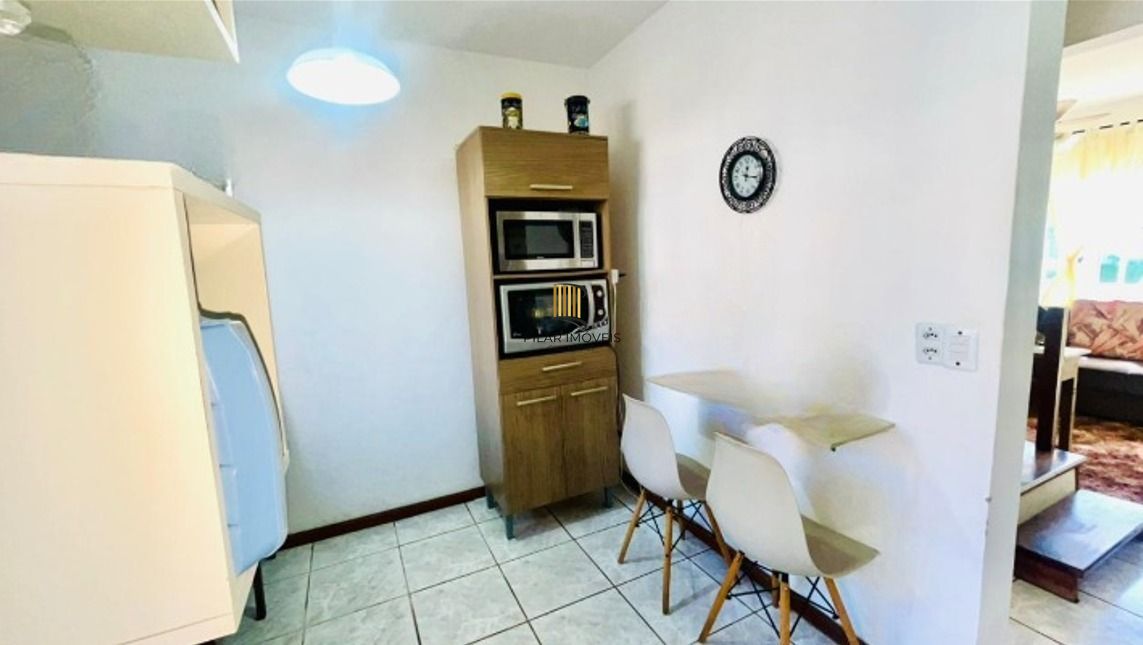 Casa em condomínio no bairro Sarandi de 2 dormitórios, vaga e infra