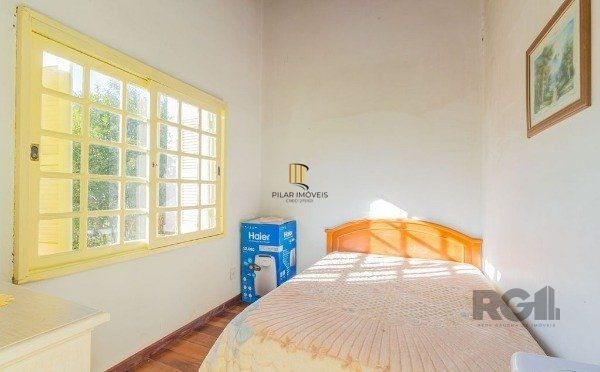 Casa sobrado na Lomba do Pinheiro com 4 dormitórios e 2 vagas