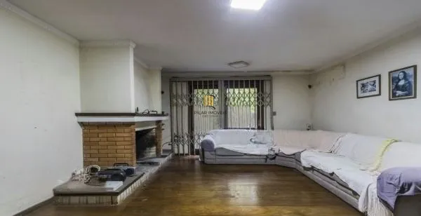 Casa sobrado no bairro Auxiliadora de 5 dormitórios e 4 vagas