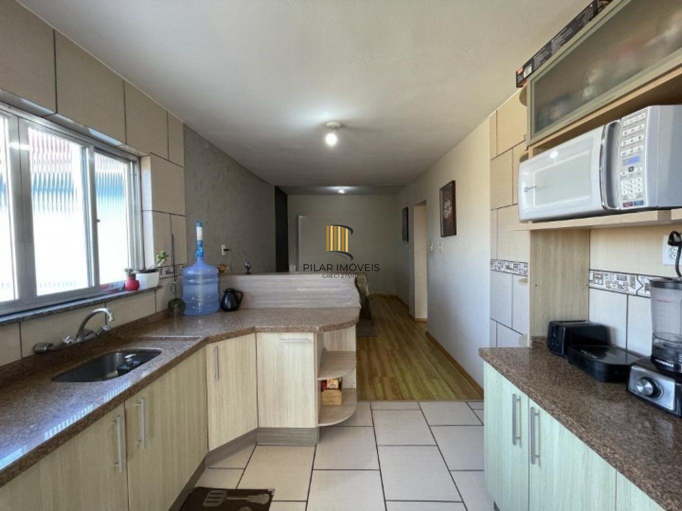 Casa geminada com 3 quartos, vaga de garagem e sacada no bairro Jardim Sabara