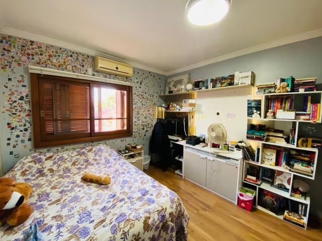 Casa de 3 dormitórios, elevador e 3 vagas de garagem em Canoas.