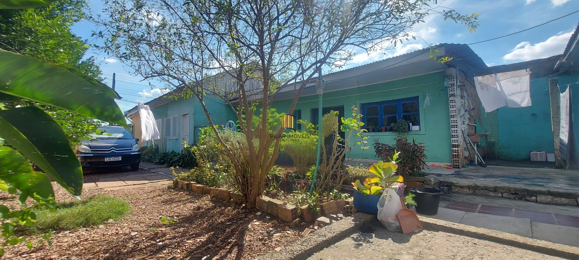 Imóvel com 2 moradias e ponto comercial em Alvorada