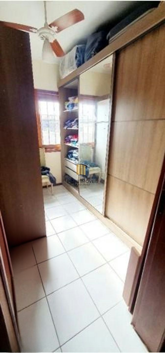 Casa com 5 quartos, piscina e 3 vagas de garagem em Canoas.