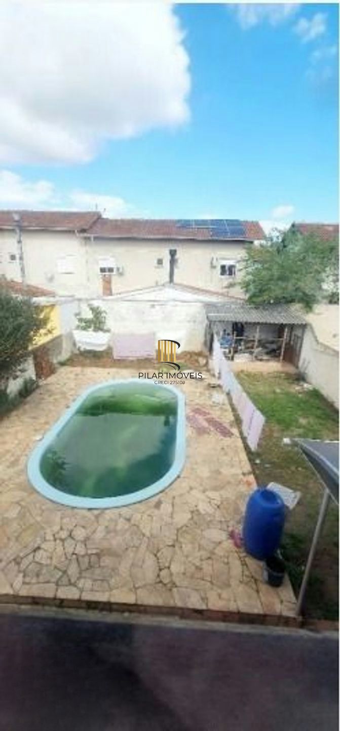 Casa com 5 quartos, piscina e 3 vagas de garagem em Canoas.