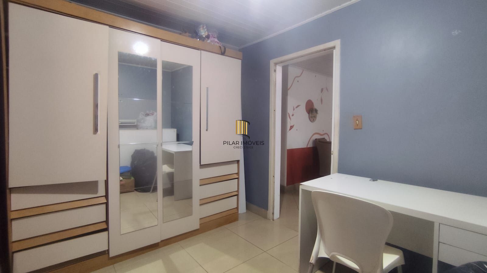 Casa térrea de 3 quartos, suíte, 3 vagas no bairro Santa Fé