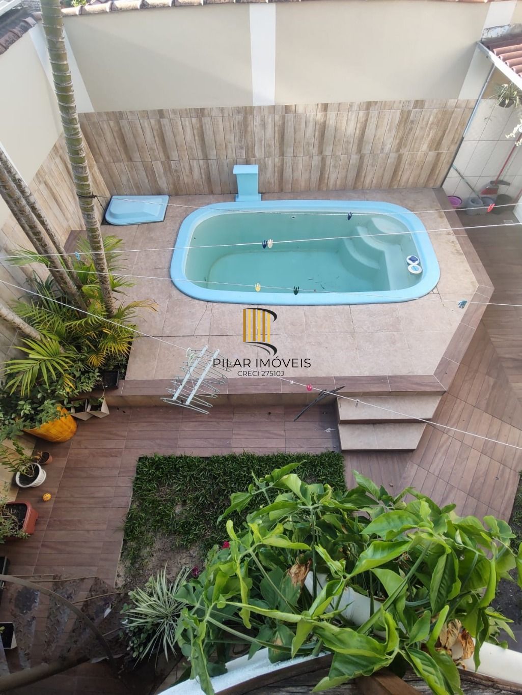 Casa de 3 dormitórios e 2 vagas de garagem em Cachoerinha. - Pilar Imóveis