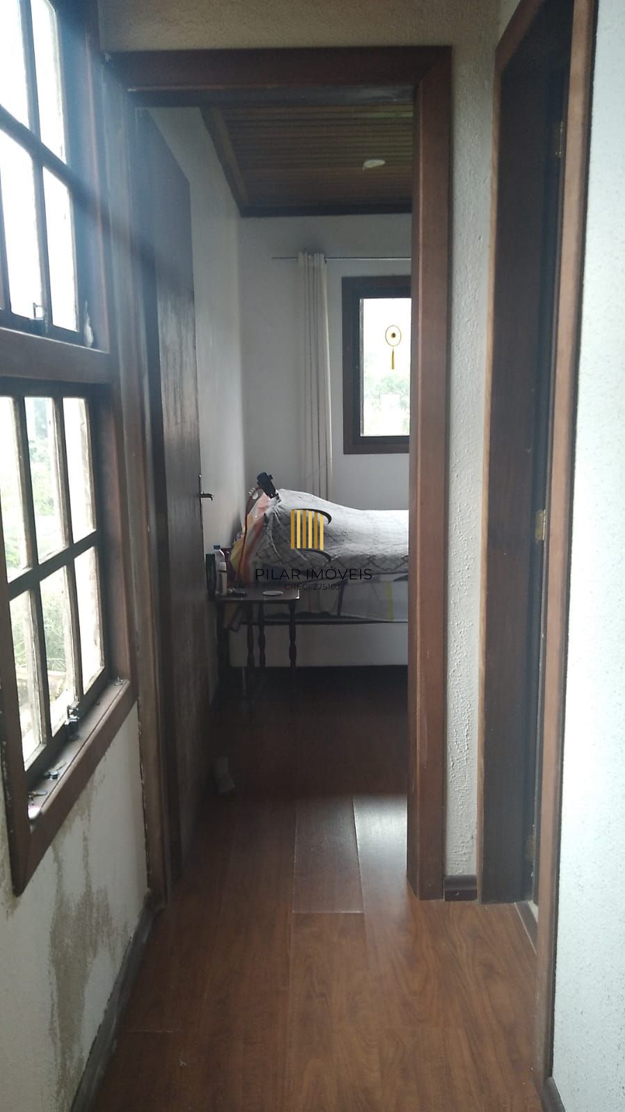 Casa de 2 quartos, churrasqueira, pátio, 2 vagas no bairro Lomba do Pinheiro