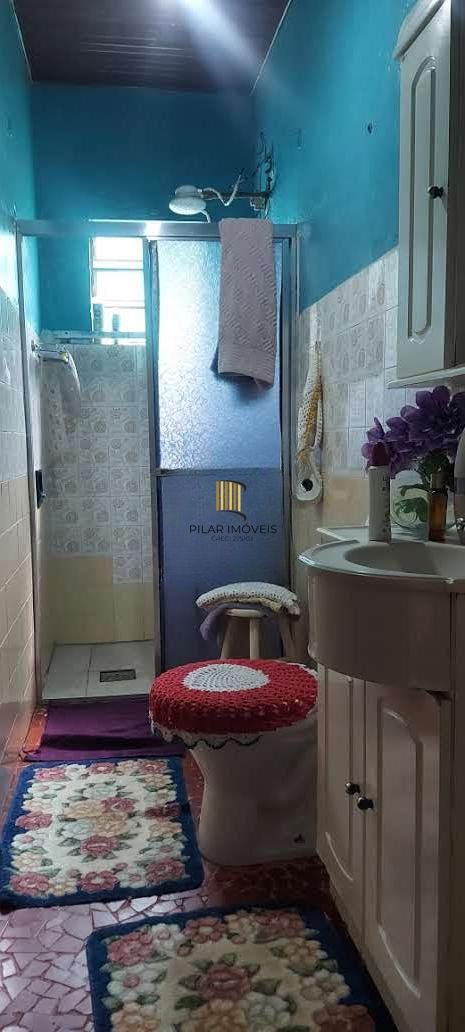 Imóvel com 2 moradias e ponto comercial em Alvorada