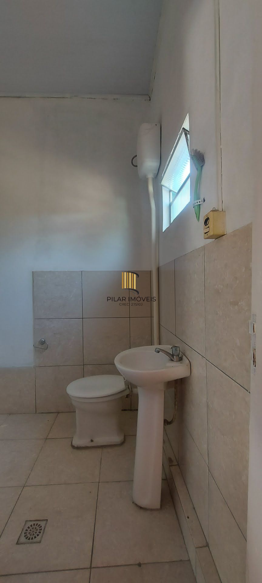 Imóvel com 2 moradias e ponto comercial em Alvorada