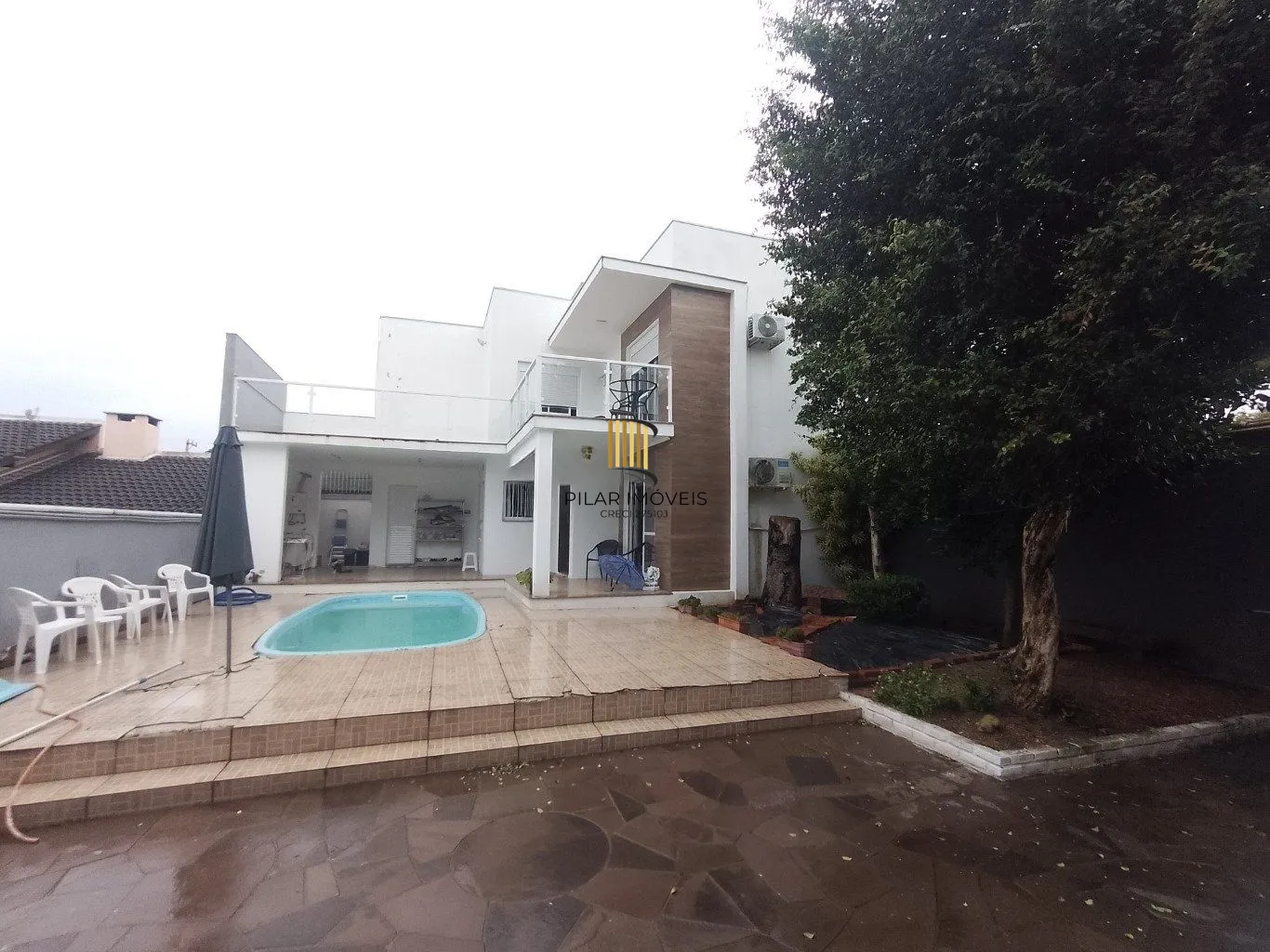 Casa de 5 dormitórios, piscina e 4 vagas de garagem em Canoas. - Pilar Imóveis