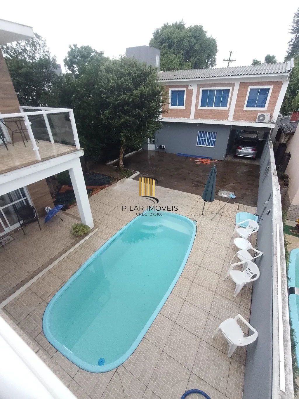 Casa de 5 dormitórios, piscina e 4 vagas de garagem em Canoas.