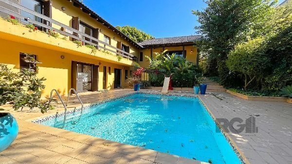 Casa Condominio em Porto Alegre, no bairro Cavalhada, com 4 dormitório(s), e 4 b