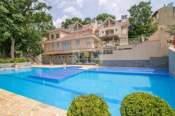 Casa de Condomínio 3 dormitórios no bairro Pedra Redonda