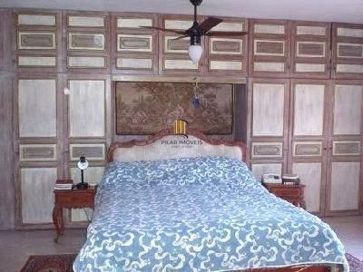 Casa em Porto Alegre, no bairro Jardim Isabel, com 4 dormitório(s), à venda.