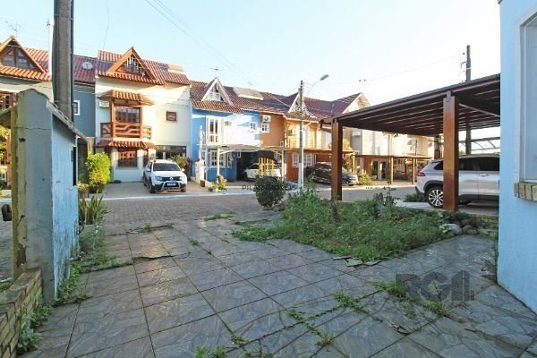 Casa Condominio em Porto Alegre, no bairro Guarujá, com 3 dormitório(s), e 3 ban
