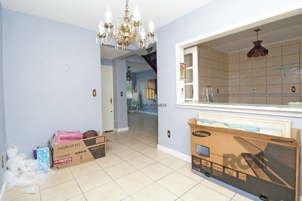 Casa Condominio em Porto Alegre, no bairro Guarujá, com 3 dormitório(s), e 3 ban