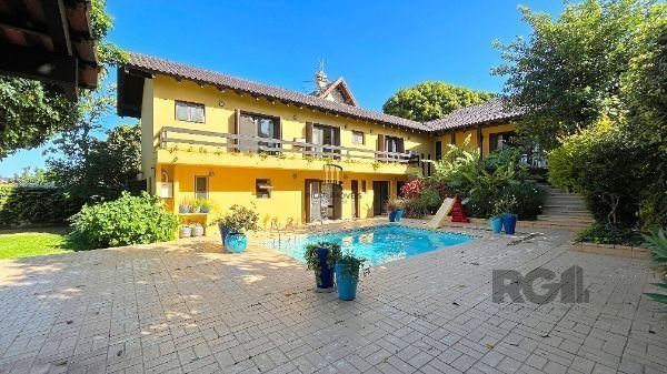 Casa Condominio em Porto Alegre, no bairro Cavalhada, com 4 dormitório(s), e 4 b