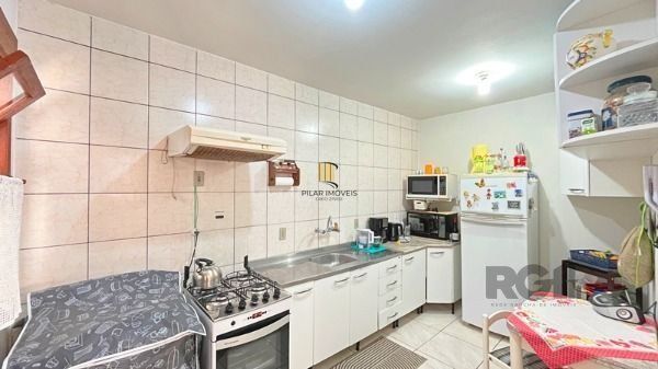 Casa Condominio em Porto Alegre, no bairro Tristeza, com 3 dormitório(s), e 3 ba