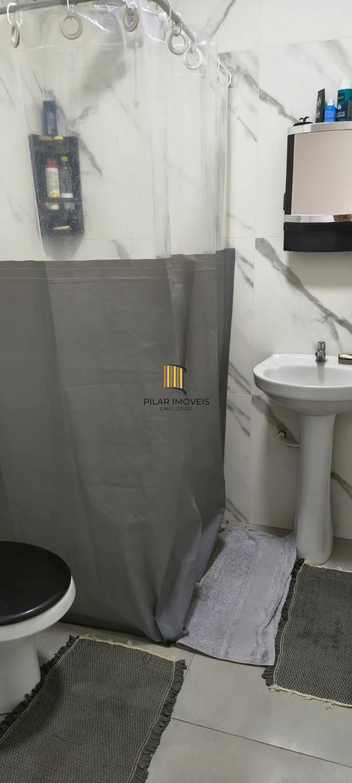 Casa na praia com 2 dormitórios e vaga — aceita troca por apartamento em Porto Alegre