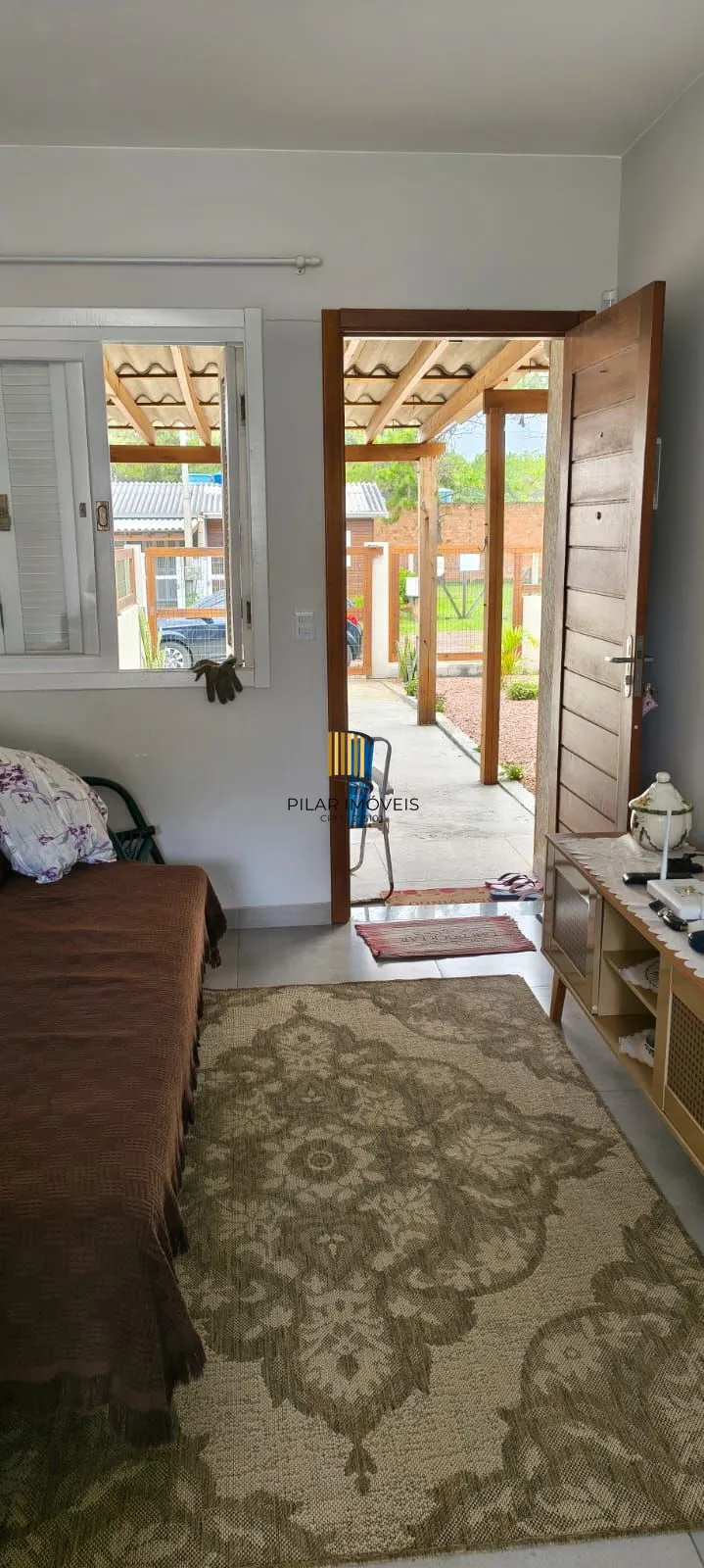 Casa na praia com 2 dormitórios e vaga — aceita troca por apartamento em Porto Alegre