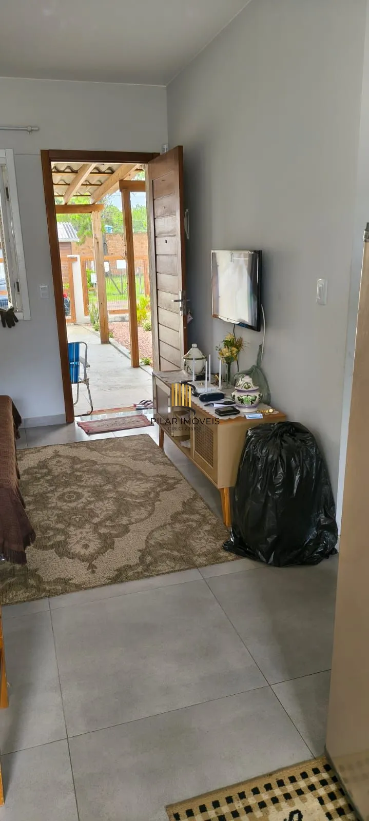 Casa na praia com 2 dormitórios e vaga — aceita troca por apartamento em Porto Alegre