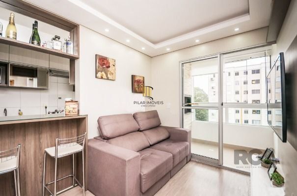 Apartamento com 2 quartos, sala, cozinha, sacada com churrasqueira e 1 vaga.