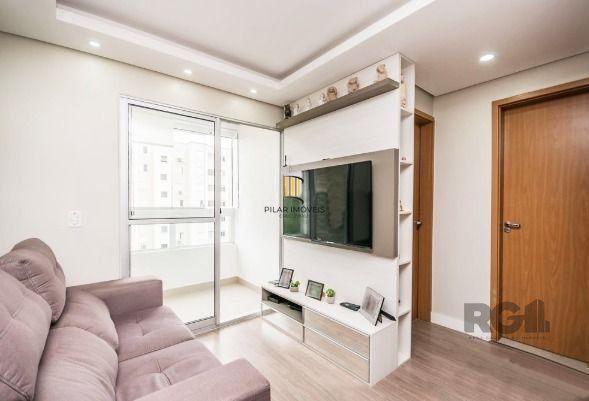 Apartamento com 2 quartos, sala, cozinha, sacada com churrasqueira e 1 vaga. - Pilar Imóveis