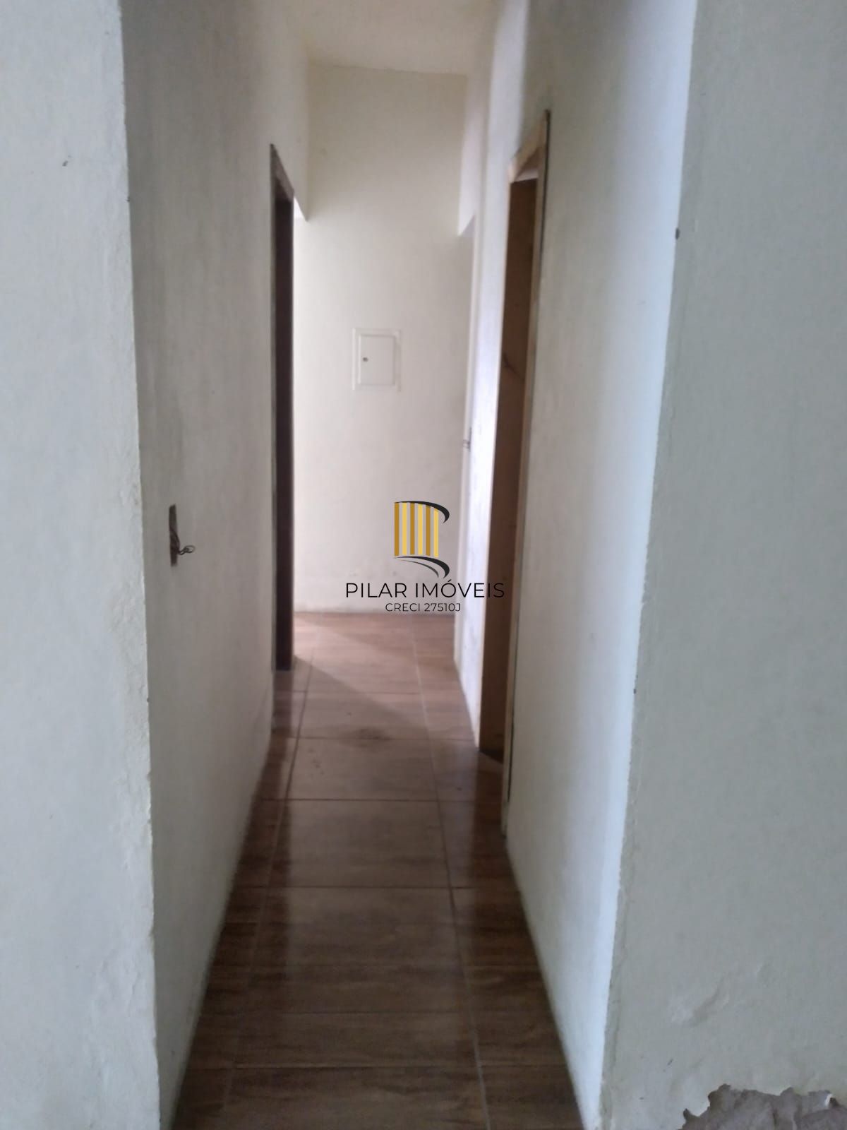 Casa com 2 dorm.  de  alvenaria em região arborizanada.