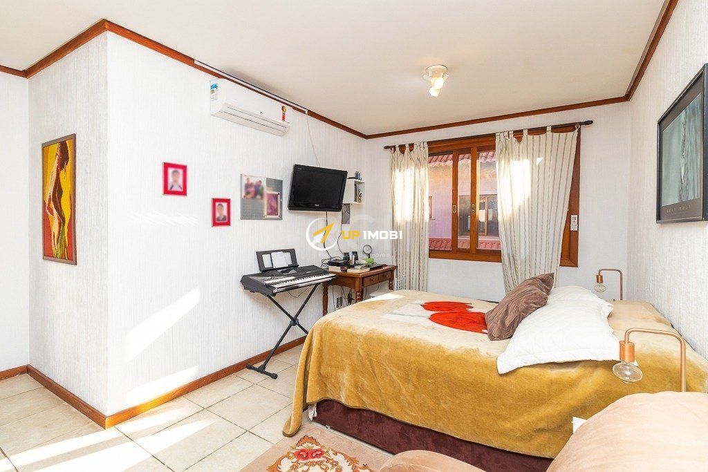 Casa de Condomínio, 3 dormitórios no bairro Santa Tereza em Porto Alegre para Comprar