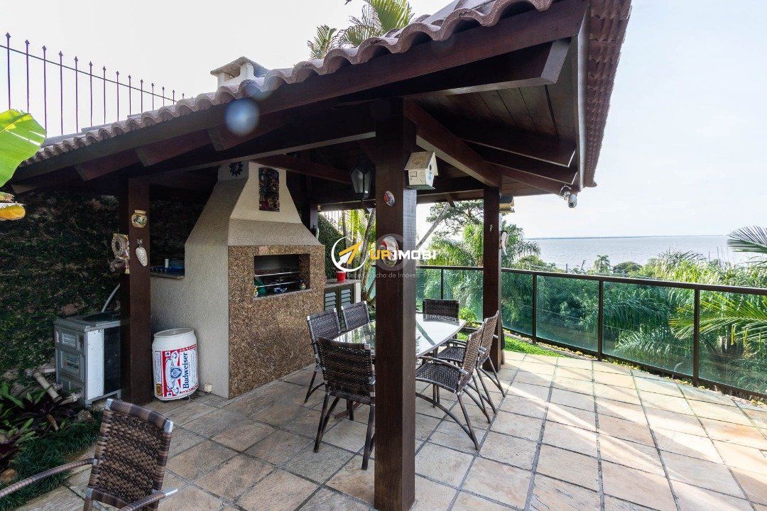 Casa com 430m², 4 dormitórios no bairro Vila Assunção em Porto Alegre para Comprar